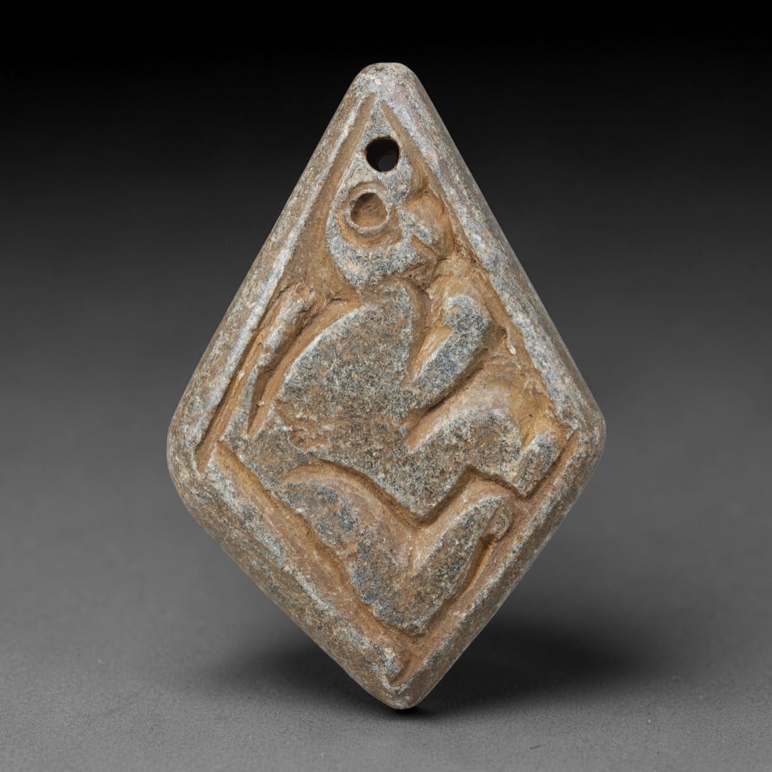 Ancient Near Eastern Hand Carved Schist Protective Amulet, 53WT: Compact antique wearable sacred talisman hand hewn from natural speckled schist metamorphic stone, originating from the broad cultural sphere of the Ancient Near East. Schist was a staple carving mine