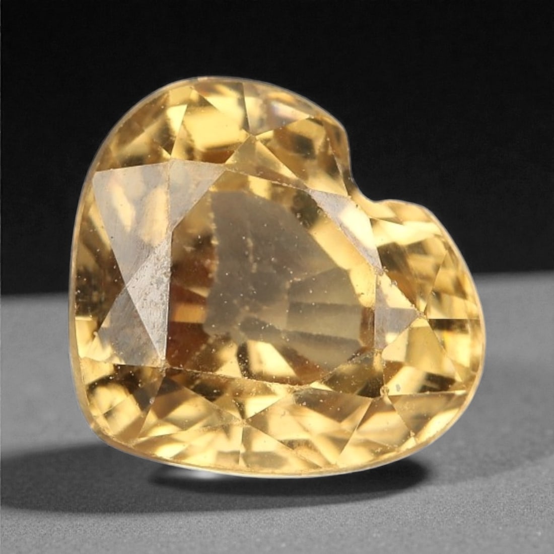1.93 Carats Golden Champagne Zircon - Natural Cambodian Stone , 69WC: This radiant heart-shaped zircon glows with a golden champagne tone, offering a warm brilliance that feels both romantic and refined. With a lively mix of honey and amber flashes, the stone displays e