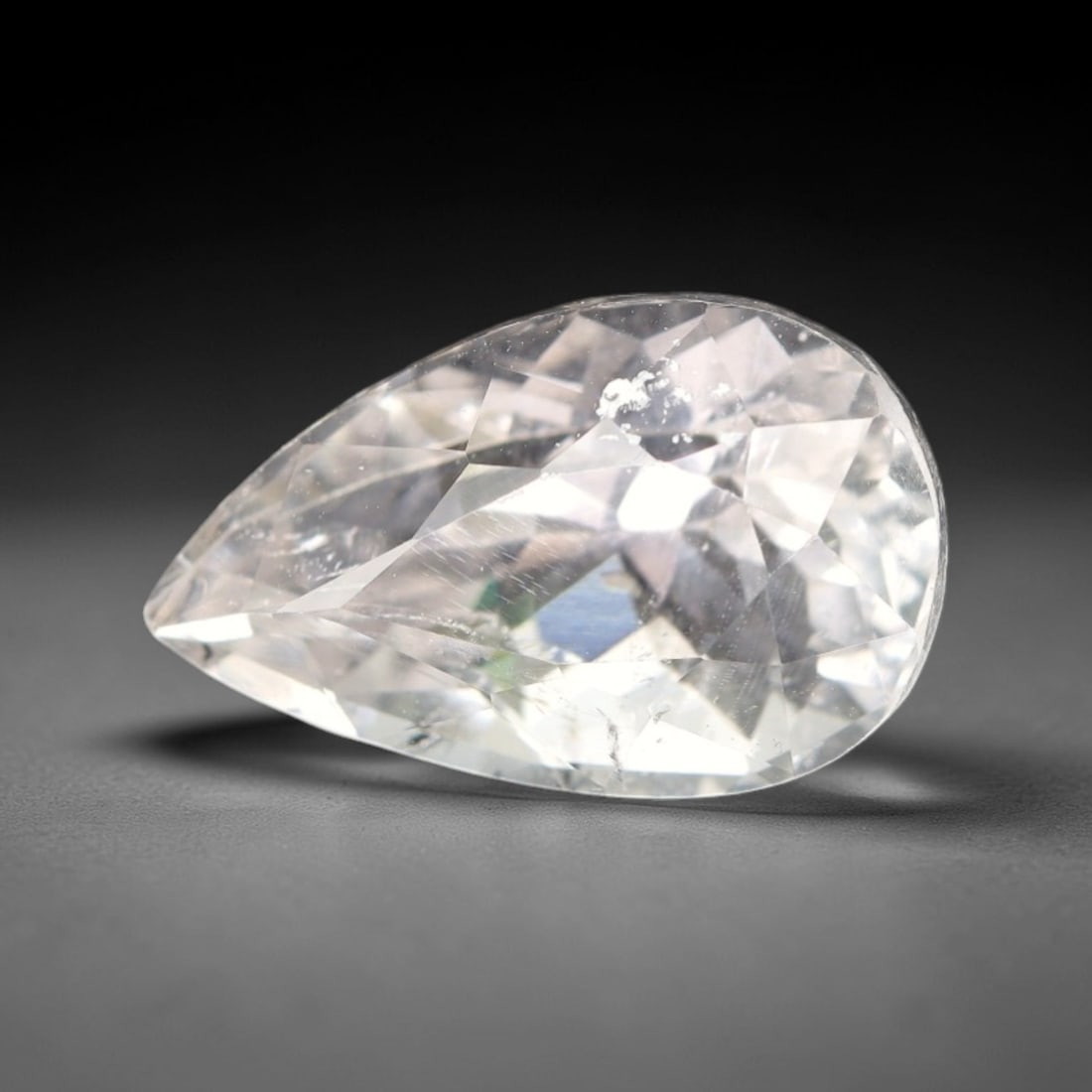 7.76 Carats Colorless Kunzite - Natural Afghan Gemstone, 24XP: This magnificent 7.76 carat pear mixed-cut kunzite measures 15.2 x 9.4 x 9 mm, boasting a brilliant, crystal-clear colorless clarity that mirrors the purity of glacial ice. The expertly executed pear 