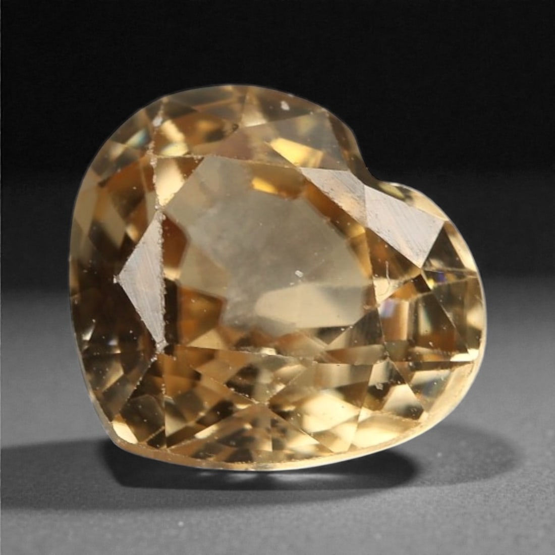 1.73 Carats Golden Champagne Zircon - Natural Cambodian Stone , 45WC: This radiant heart-shaped zircon glows with a golden champagne tone, offering a warm brilliance that feels both romantic and refined. With a lively mix of honey and amber flashes, the stone displays e