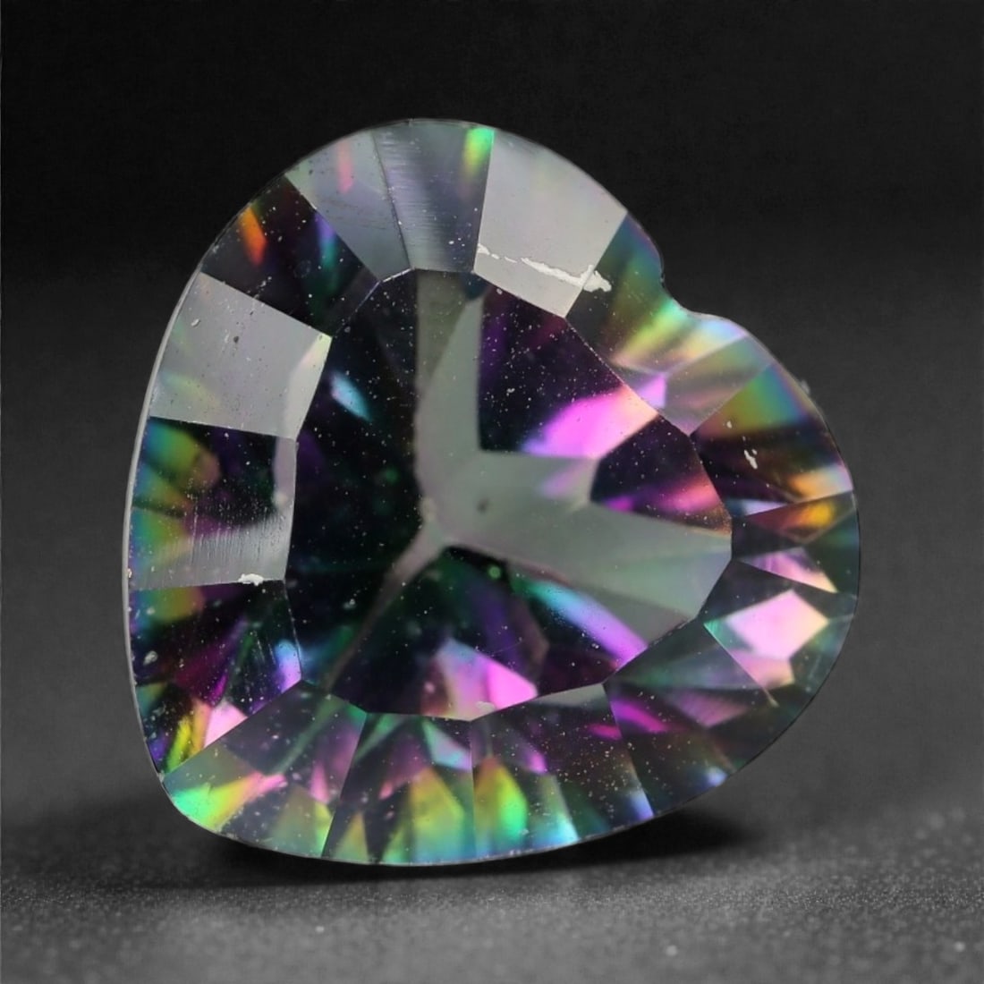 3.73 Carats Iridescent Mystic Topaz - Heart Cut Natural Stone , 97WC: This heart-shaped mystic topaz dazzles with a vivid spectrum of shifting colors-from deep emerald greens and royal purples to flashes of gold and fuchsia. Its finely cut facets enhance the gem's optic