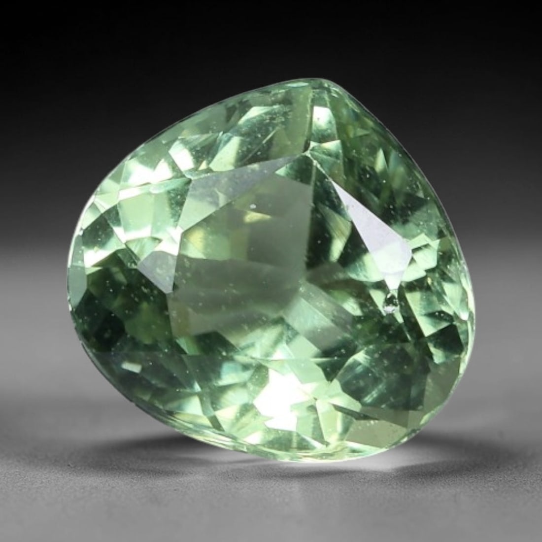 1.20 Carats Mint Green Tourmaline Pear Cut - Natural Loose Gemstone, 48XC: This delicate pear-cut tourmaline showcases a soft, luminous mint-green hue, evoking the calm of sunlit seafoam or fresh spring foliage. Its crisp faceting creates a brilliant, sparkling play of light