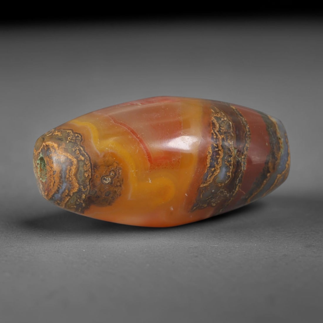 Ancient Parthian Empire Banded Carnelian Agate Barrel Trade Bead (247 BCE - 224 CE), 7XV: This antique banded carnelian barrel bead originates from Parthian Iranian craft workshops, master stone carvers who created vivid multi-layered chalcedony talismans traded extensively along the Silk 