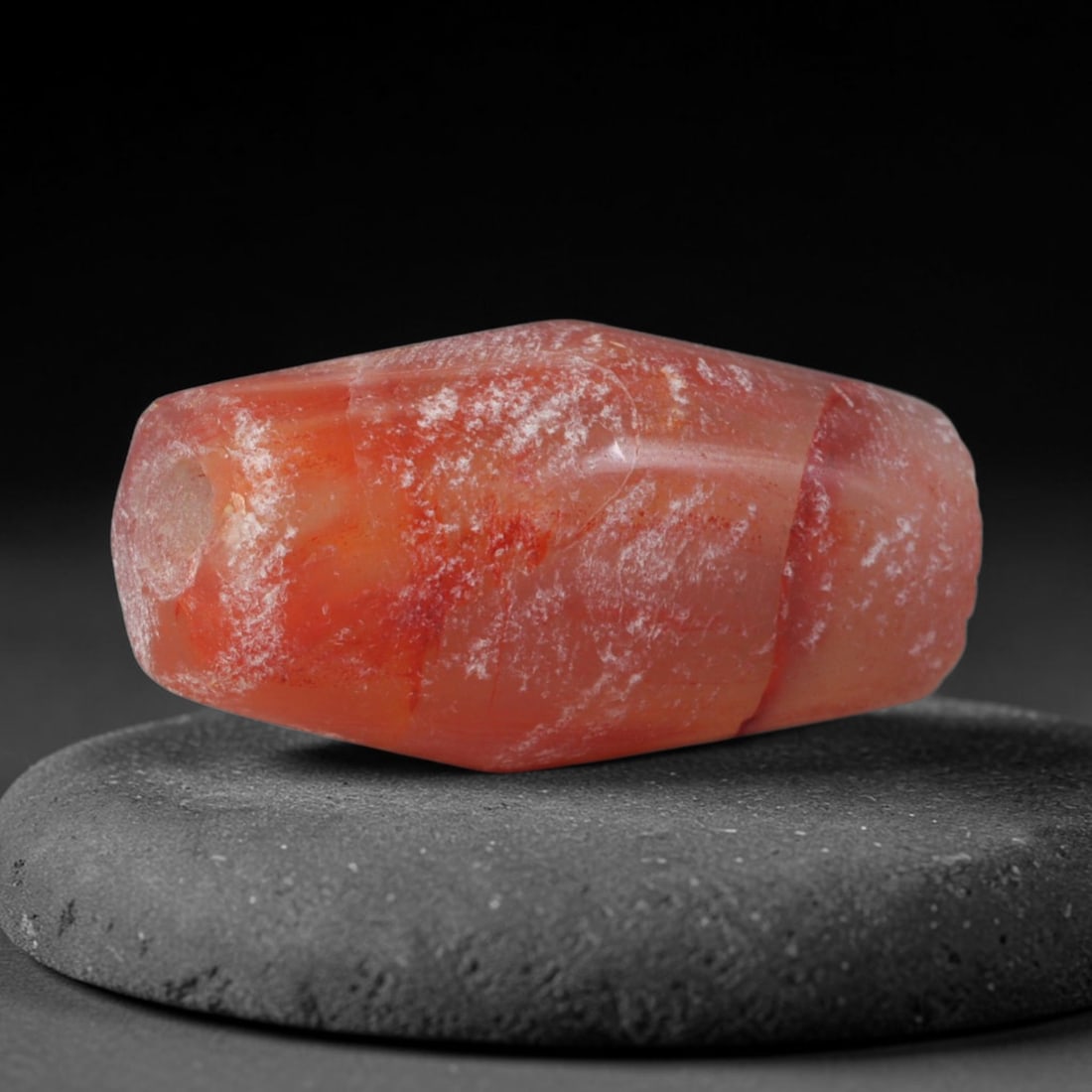 Ancient Han Dynasty Carnelian Bicone Bead (202 BCE-220 CE), 73XD: This antique faceted bicone carnelian bead originates from the Han Dynasty, a pivotal East Asian civilization that valued red chalcedony as a symbol of vitality for court jewelry, burial grave goods, 