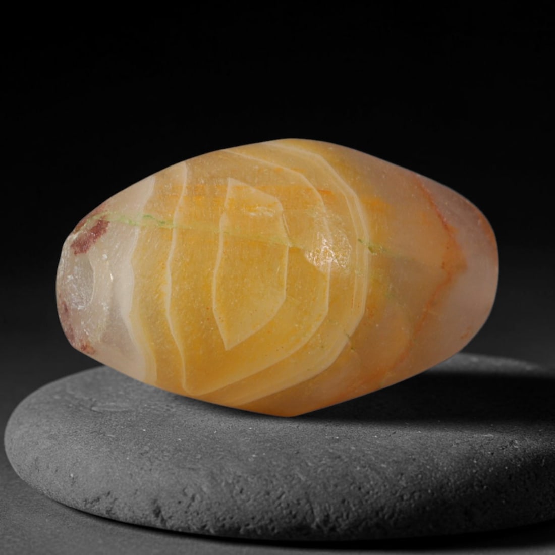 Ancient Achaemenid Persian Empire Banded Agate Barrel Bead (550-330 BCE), 75XD: This antique banded agate barrel bead originates from the Achaemenid Persian Empire, an ancient Iranian civilization with imperial workshops crafting fine banded chalcedony beads for royal diplomatic 