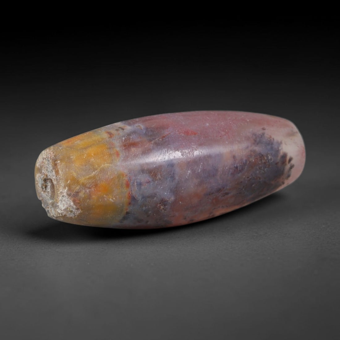 Ancient Central Asian Steppe Moss Chalcedony Barrel Trade Bead (800-200 BCE), 11XV: This antique moss chalcedony barrel bead originates from Eurasian Steppe nomadic cultures, master craftsmen who fashioned earth-toned inclusion-rich hardstone talismans for inter-tribal exchange and e