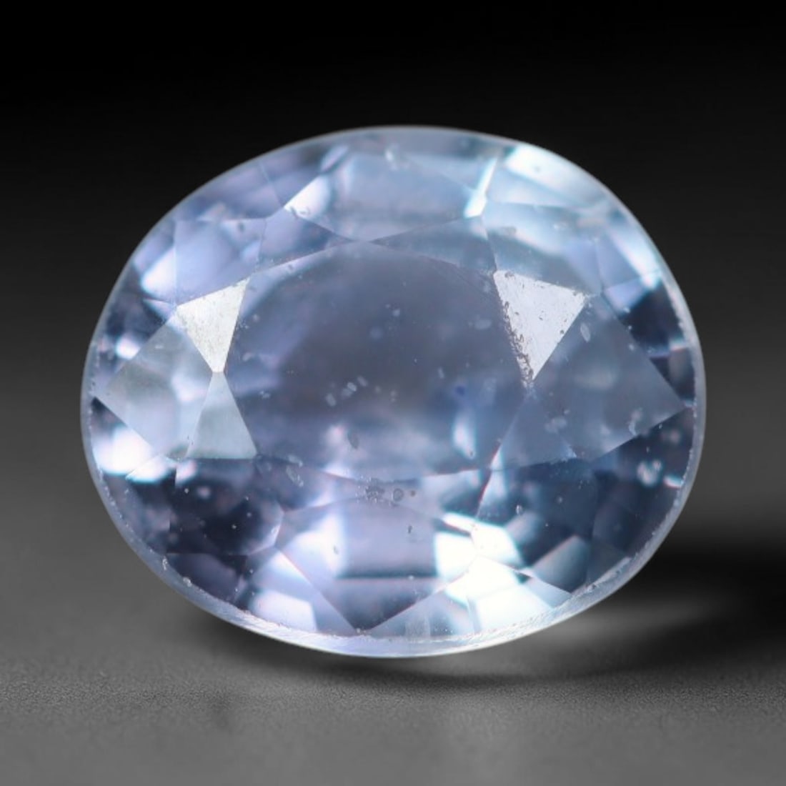 0.46 Carats Natural Blue Sapphire Oval Faceted Loose Gemstone, 64XV: Natural light blue corundum sapphire precision cut into an oval faceted loose gemstone, polished with mixed brilliant facets to boost light refraction. The stone displays a soft pale sky blue shade wi
