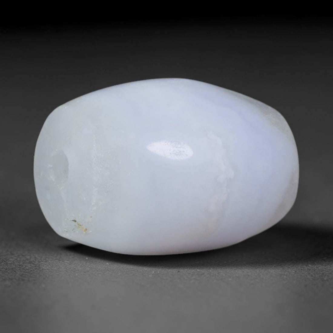 Ancient Sogdian Soft Lavender Chalcedony Short Barrel Mini Amulet Bead (500-1000 CE), 37XD: This stout compact miniature barrel bead was carved by Sogdian Silk Road craftsmen, created as smooth unadorned protective talismans for stacking necklaces and pocket amulets carried by ancient carava