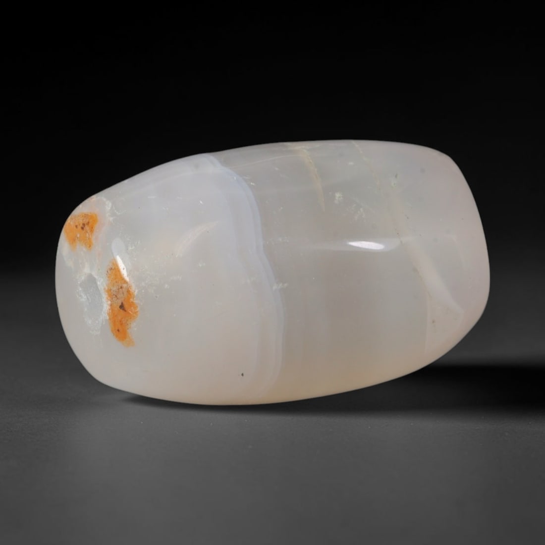 Ancient Early Historic Indian Kingdoms Banded Agate Barrel Bead, 65XD: This antique banded agate barrel bead originates from Early Historic Indian Kingdoms encompassing the Maurya, Shunga, and Gupta Empires, South Asian polities that refined chalcedony bead craft to prod