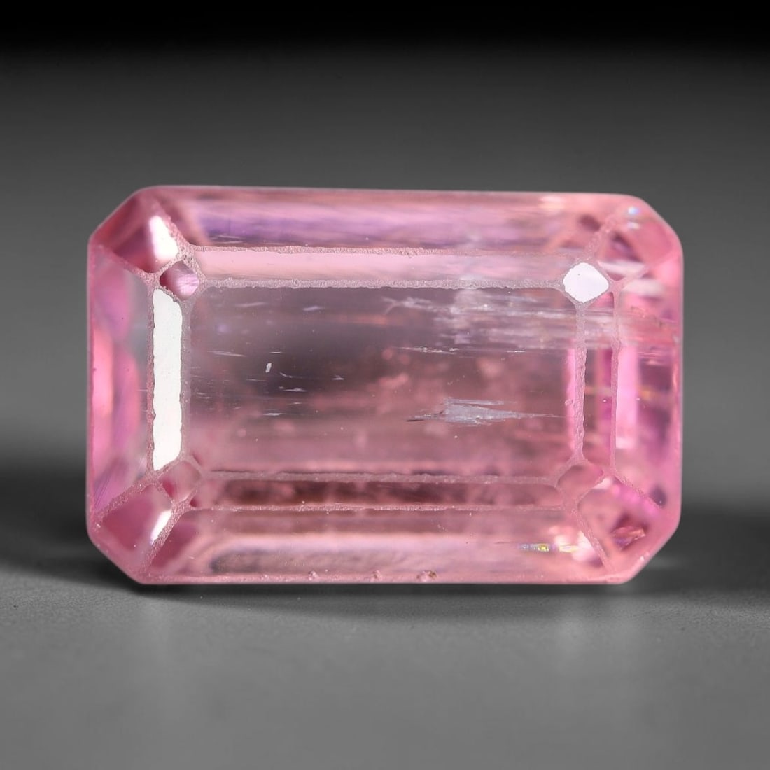 3.36 Carats Natural Pastel Pink Emerald Cut Tourmaline Loose Faceted Gemstone, 99XZ: Natural soft pastel pink elbaite tourmaline precisely cut into a classic emerald step-cut loose gemstone, defined by orderly linear step facets that deliver clean, diffused light reflection. The cryst