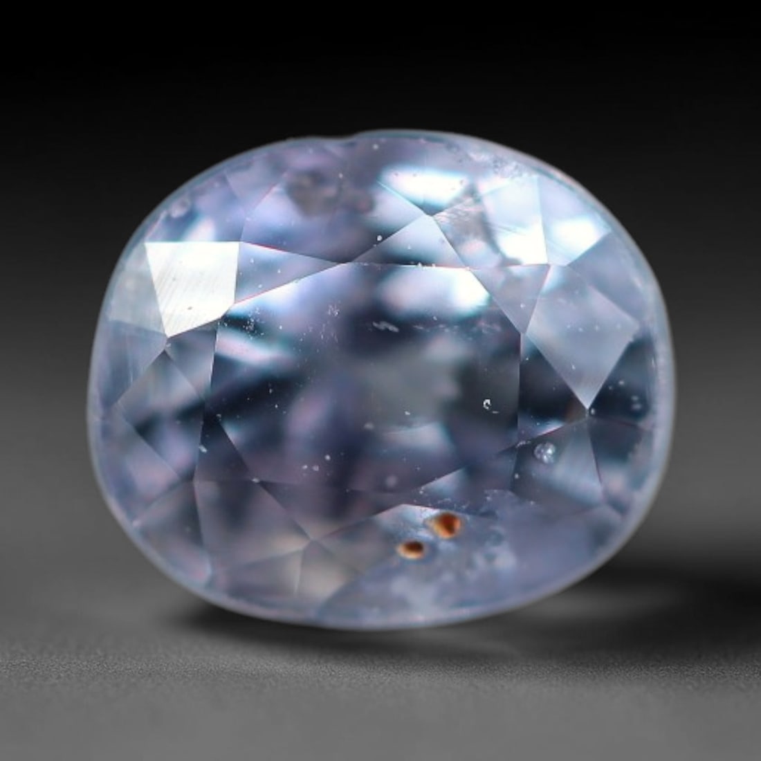 0.52 Carats Natural Lavender Blue Cushion Oval Sapphire Faceted Loose Gemstone, 83XV: Natural cool lavender-blue corundum sapphire precision cut into a soft cushion oval faceted loose gemstone, finished with mixed brilliant facets to deliver soft diffused light sparkle. The crystal hol