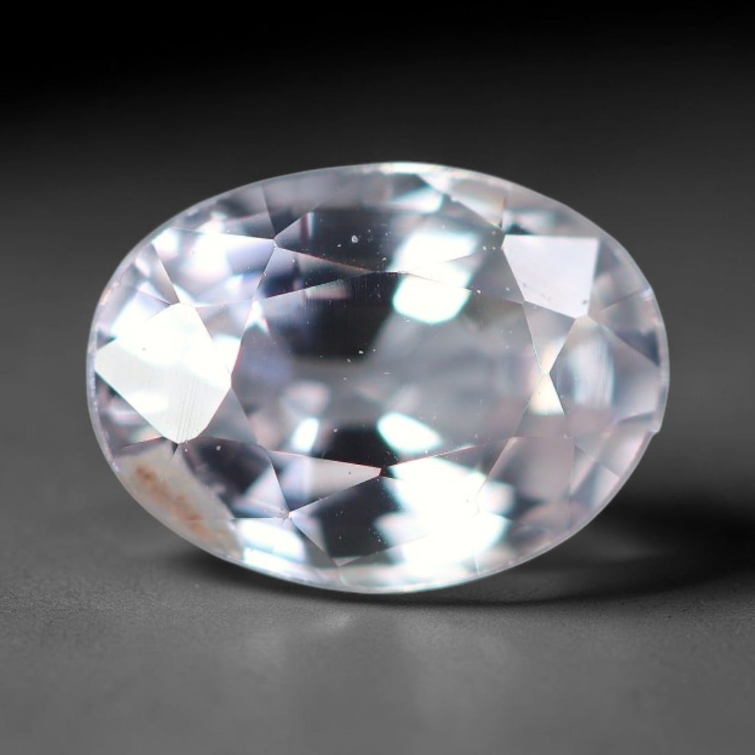 0.53 Carats Natural White Sapphire Oval Faceted Loose Gemstone, 74XV: Natural colorless white corundum sapphire precision cut into an oval faceted loose gemstone, polished with mixed brilliant facets to deliver exceptional light sparkle. The crystal is fully transparent