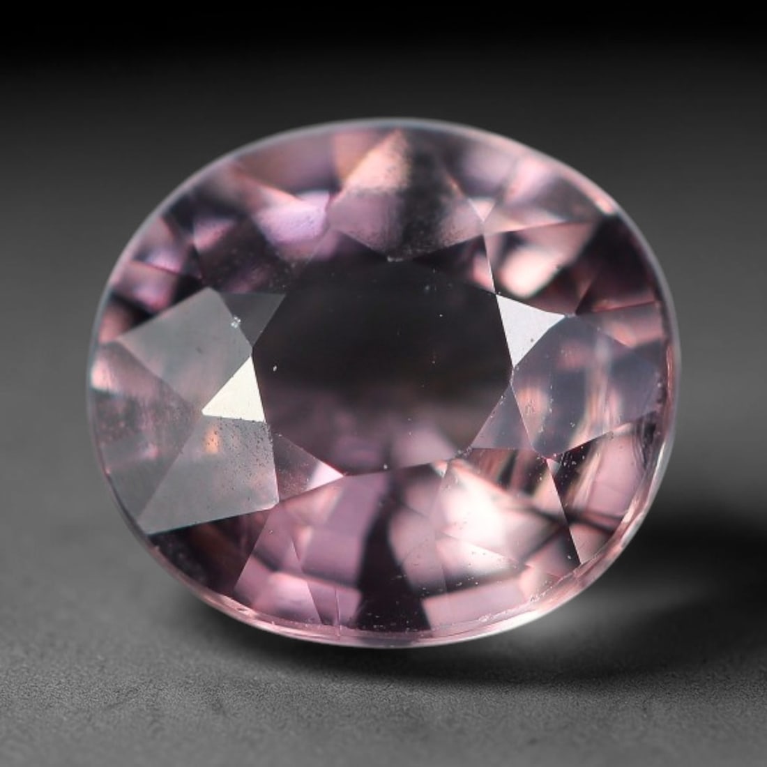 0.57 Carats Natural Mauve Pink Sapphire Round Oval Faceted Loose Gemstone, 75XV: Natural soft mauve-pink corundum sapphire expertly cut into a rounded oval faceted loose gemstone, crafted with mixed brilliant facets to enhance gentle pink-lavender color glow and light return. The 