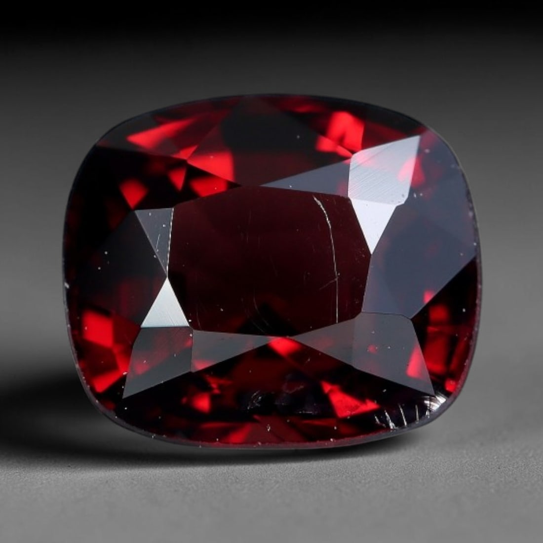 0.98 Carats Natural Deep Crimson Red Cushion Spinel Loose Faceted Gemstone, 87XV: Natural rich deep crimson red spinel expertly cut into a soft cushion faceted loose gemstone, crafted with mixed brilliant facets to intensify fiery red saturation and striking light return. The cryst