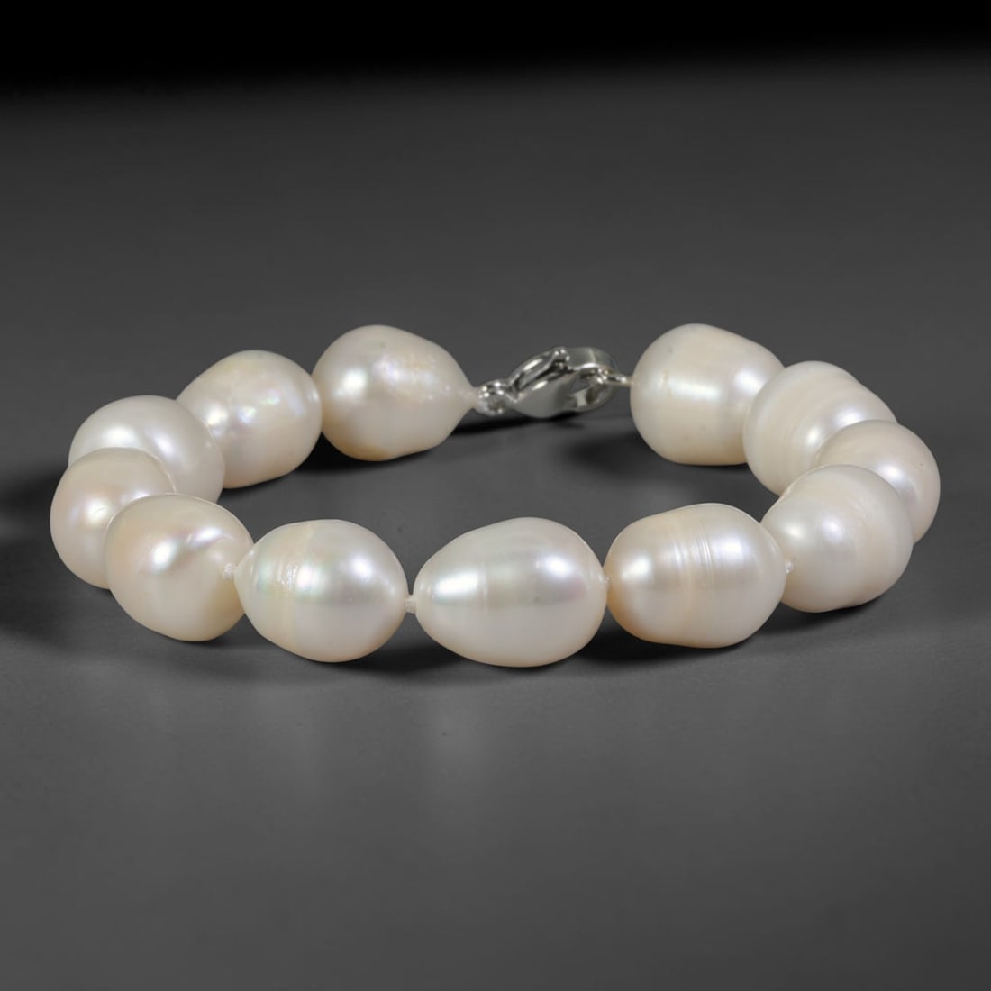 Natural Freshwater Pearl Bracelet - Large Baroque Cream Pearl Strand, 84YM: Constructed from substantial organic baroque natural freshwater pearls with rich creamy white pearlescent luster, each bead showcasing oversized asymmetrical teardrop and oval contours formed through 