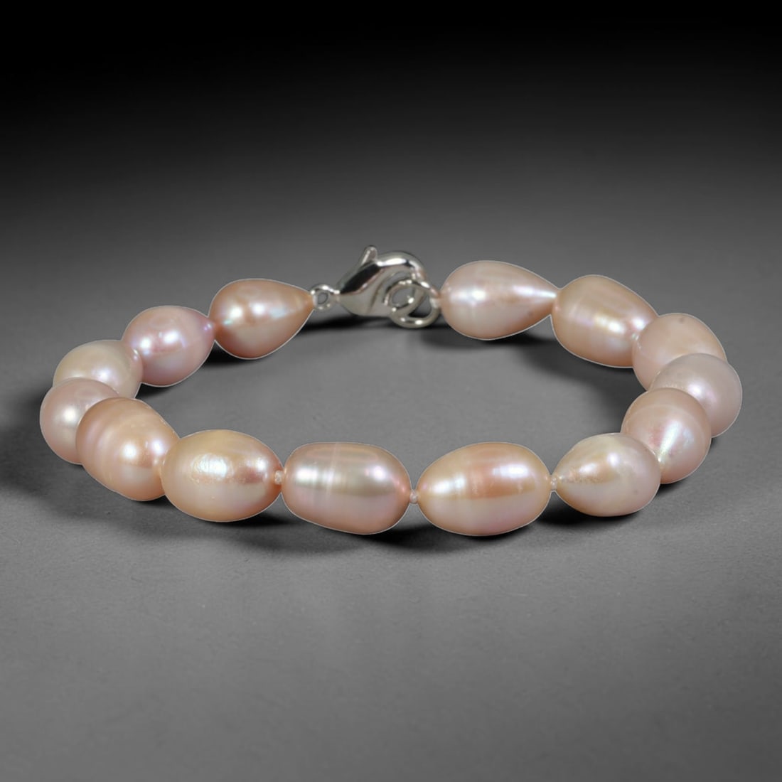 Natural Freshwater Pearl Bracelet - Baroque Blush Pink Pearl Strand, 83YM: Constructed from large organic baroque natural freshwater pearls showcasing soft blush pink pearlescent luster, each bead presenting smooth asymmetrical oval forms formed through natural freshwater pe