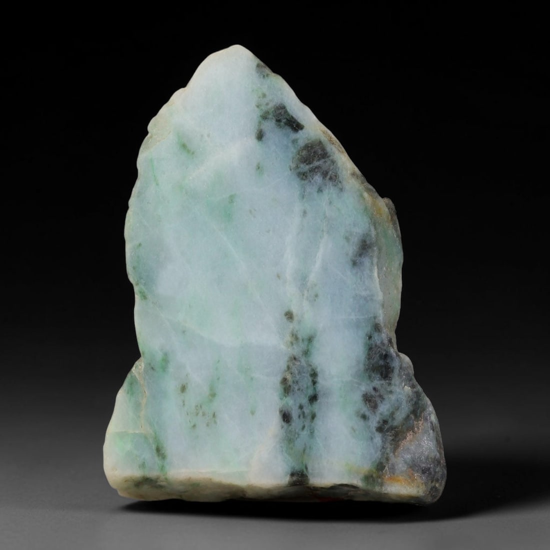 375ct Natural Type A Burmese Jadeite Jade Sliced Rough, 75YK: This specimen is a sliced rough block of natural Type A Burmese jadeite jade. The interior displays natural colour zoning with visible mineral veining and crystalline patterns typical of unprocessed j