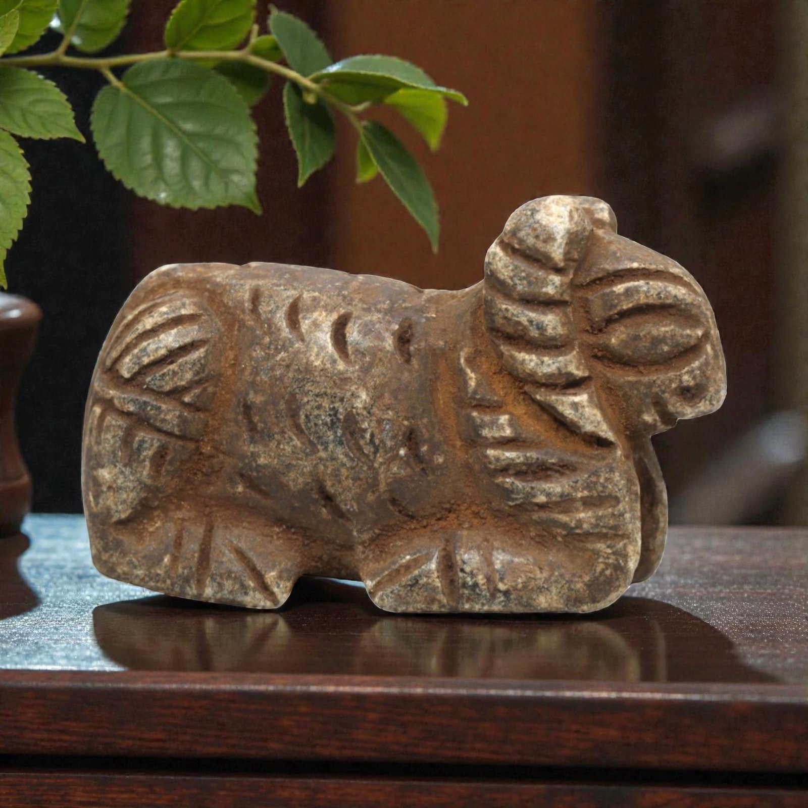 Ancient Schist Ram - Zoomorphic Amulet Figurine, 66ZP: This zoomorphic amulet is carved from schist, shaped into a recumbent ram with incised linear details defining the curled horns, textured fleece, and stylized limbs. Stylistically consistent with Near