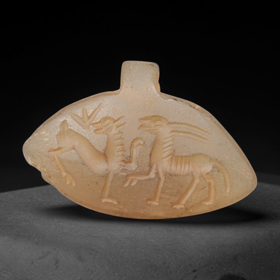 Ancient Sasanian Hand Engraved Chalcedony Plaque Amulet, 42WT: Mid-sized antique wearable sacred tablet expertly carved from natural translucent chalcedony mineral, originating from ancient Sasanian Persian cultural and devotional craft traditions. Chalcedony was