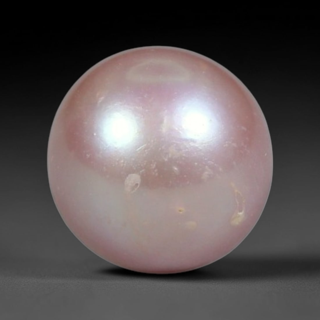 2.46ct Natural Round Freshwater Peach Pink Pearl Loose Gemstone 7.3mm, 17XA: Flawless natural undrilled round freshwater pearl, showcasing a smooth symmetrical spherical form with soft gradient peach blush nacre transitioning from warm apricot crown to pale pink base. The pear