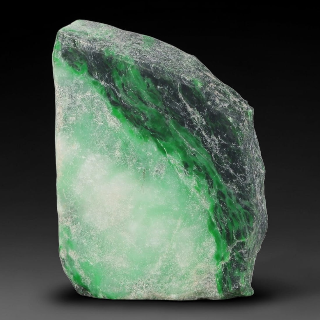 165ct Natural Type A Burmese Jadeite Jade Sliced Rough, 42YK: This specimen is a sliced rough block of natural Type A Burmese jadeite jade. The interior displays natural colour zoning with visible mineral veining and crystalline patterns typical of unprocessed j