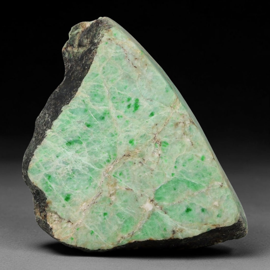 360ct Natural Type A Burmese Jadeite Jade Sliced Rough, 99YN: This specimen is a sliced rough block of natural Type A Burmese jadeite jade. The interior displays natural colour zoning with visible mineral veining and crystalline patterns typical of unprocessed j