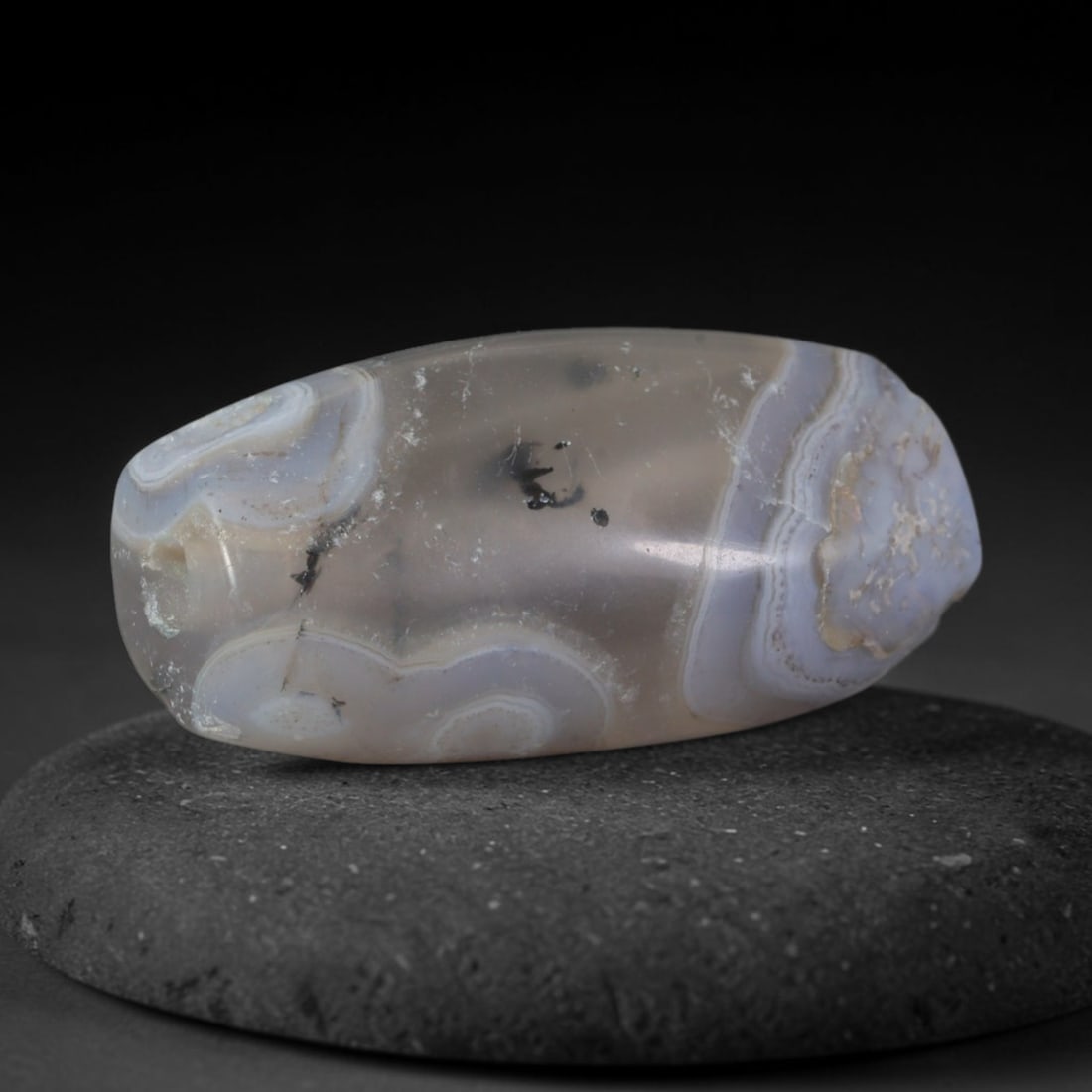Ancient Elamite Civilization Banded Agate Barrel Bead (3200-539 BCE), 62XD: This antique banded agate barrel bead originates from Elamite Civilization, an independent ancient Iranian culture that developed distinct chalcedony bead craft and traded finished agate pieces with I
