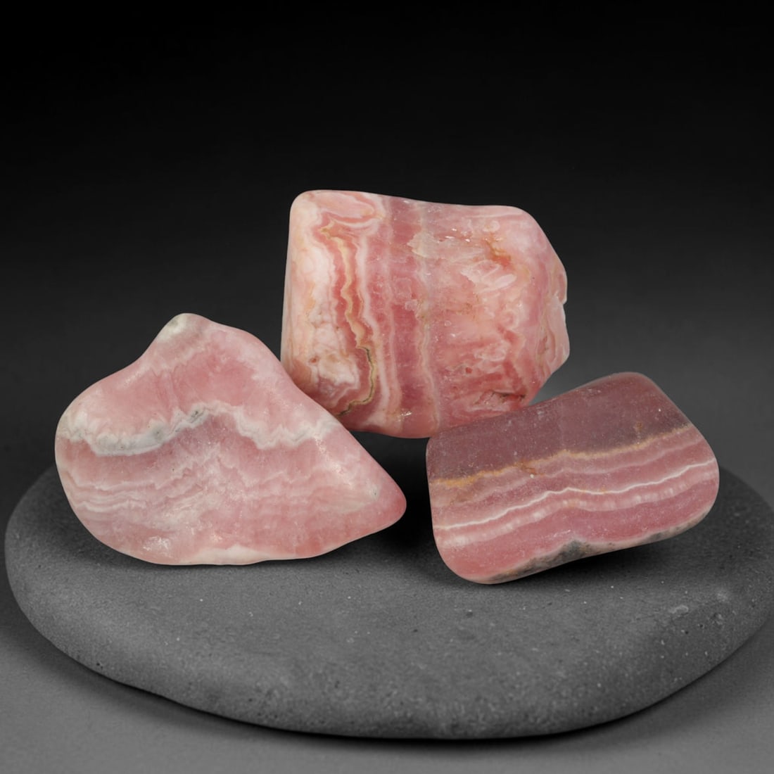 71ct 3pcs Natural Argentine Rhodochrosite Banded Tumbled Rough Set, 7YR: This listing features three individual tumbled rhodochrosite rough pieces sourced from Argentina Capillitas deposits, each showcasing distinct layered banding of soft rose pink, cream white and pale t