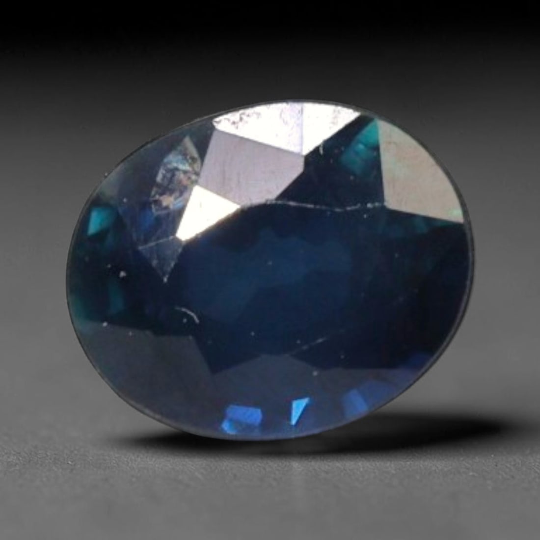 0.80 Carats Natural Madagascar Blue Sapphire Oval Faceted Gem, 65YE: I've got a real nice little precision-cut gem here to show you, this deep rich blue sapphire straight from Madagascar with lovely shifting color depth inside! It carries a rich, inky navy blue primary
