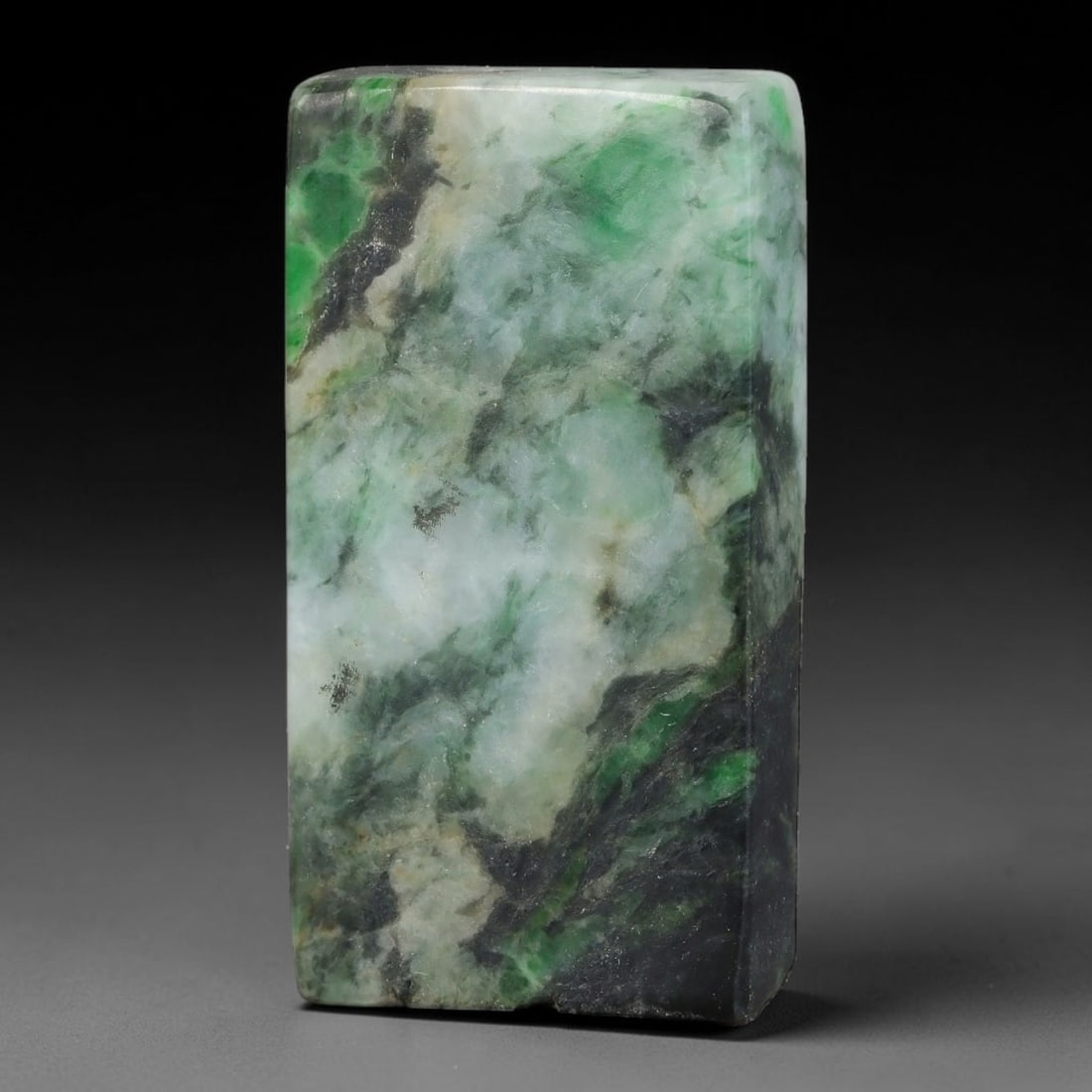 174ct Natural Type A Burmese Jadeite Jade Sliced Rough, 26YK: This specimen is a sliced rough block of natural Type A Burmese jadeite jade. The interior displays natural colour zoning with visible mineral veining and crystalline patterns typical of unprocessed j