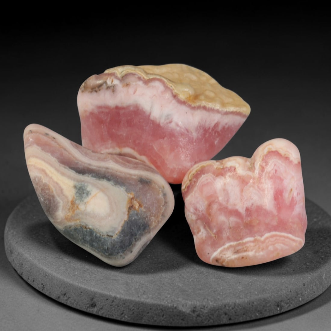 58ct 3pcs Natural Argentine Rhodochrosite Banded Tumbled Rough Set, 1YR: This listing features three individual tumbled rhodochrosite rough pieces sourced from Argentina Capillitas deposits, each showcasing distinct layered banding of soft rose pink, cream white and pale t
