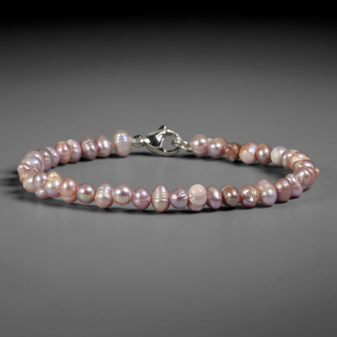 Natural Freshwater Pearl Bracelet - Tiny Baroque Lavender Pearl Strand, 65YM: Strung from miniature organic baroque natural freshwater pearls with blended lavender and soft peach iridescent overtones, each bead displaying highly varied miniature asymmetrical contours characteri