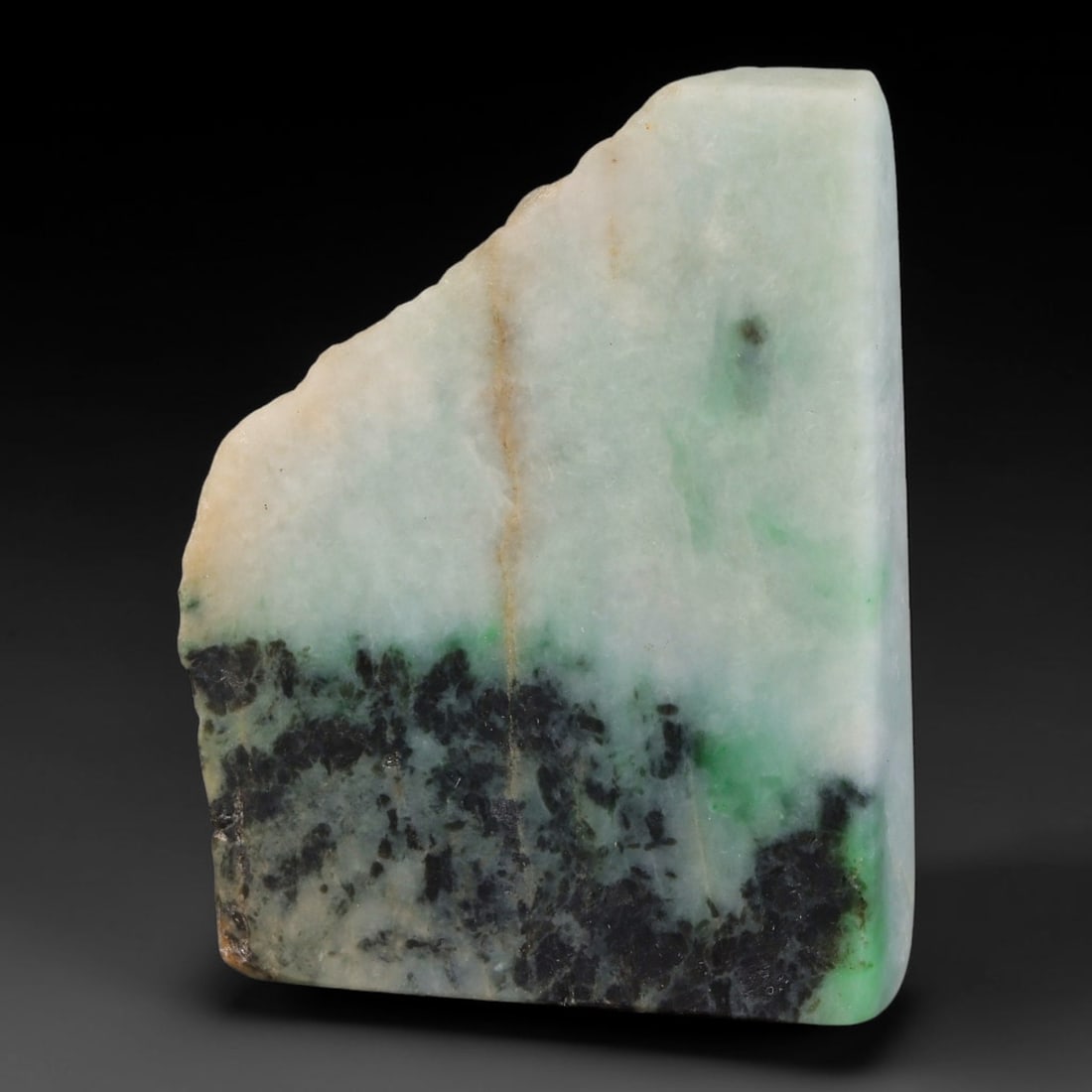 300ct Natural Type A Burmese Jadeite Jade Sliced Rough, 16YK: This specimen is a sliced rough block of natural Type A Burmese jadeite jade. The interior displays natural colour zoning with visible mineral veining and crystalline patterns typical of unprocessed j