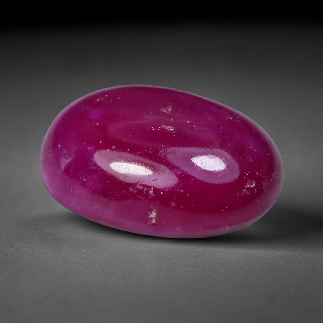 6.21 Carats Natural Rich Fuchsia Red Oval Cabochon Ruby Loose Gemstone, 34XV: Natural saturated vivid fuchsia red ruby polished oval cabochon loose gemstone, smooth domed high-gloss surface delivers velvety uniform color saturation throughout the corundum crystal. Tiny scattere