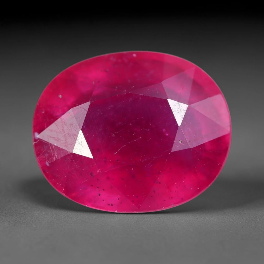 10.34 Carats Natural Madagascar Ruby Oval Faceted Loose Gemstone, 37XM: This large natural Madagascar ruby is precision cut in oval brilliant faceting, presenting an intense saturated deep crimson red tone characteristic of Malagasy corundum deposits. Fine natural mineral