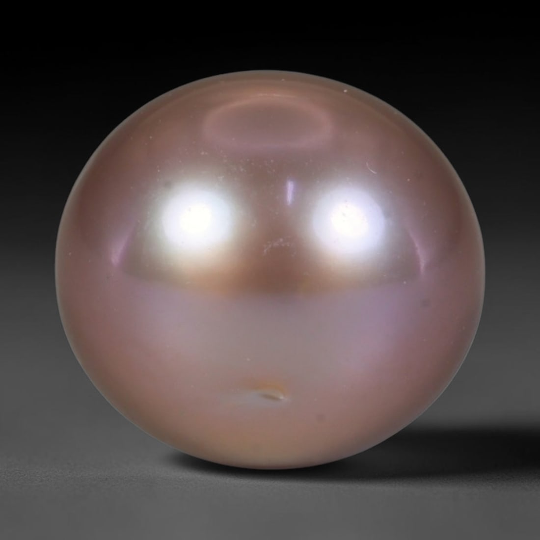 Natural Freshwater Pearl - Soft Dusty Rose Taupe Sphere 11mm, 55WE: This natural freshwater pearl presents a sleek symmetrical spherical silhouette wrapped in radiant iridescent nacre, showcasing soft dusty rose merged with gentle taupe overtones across its polished e
