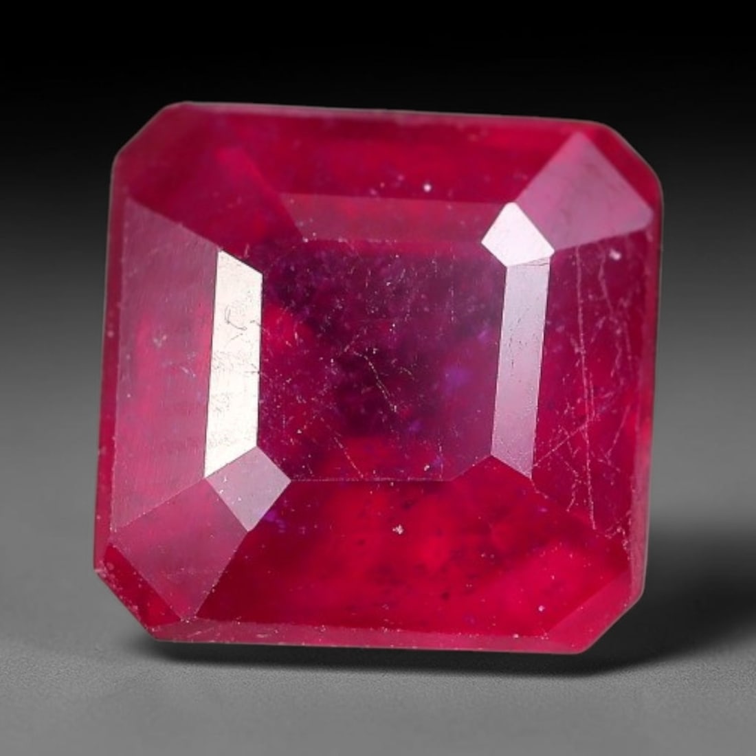 2.56 Carats Natural Madagascar Ruby Square Cushion Cut Loose Gemstone, 76XM: This natural Madagascar ruby is crafted into a square cushion modified step cut, displaying vivid saturated crimson red color typical of Malagasy corundum. Fine scattered mineral inclusions, subtle in