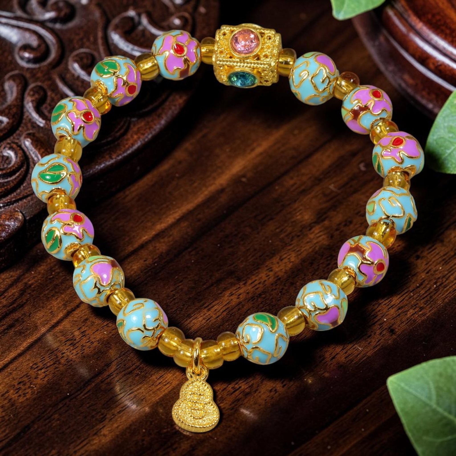 Chinese Cloisonne Enamel Beaded Bracelet - Sky Blue Gold Gourd Prosperity Charm, 71YG: This modern Chinese revival stretch bracelet features round cloisonne enamel beads measuring 7.80 millimeters, finished in soft sky blue enamel with two alternating decorative treatments: raised gold-
