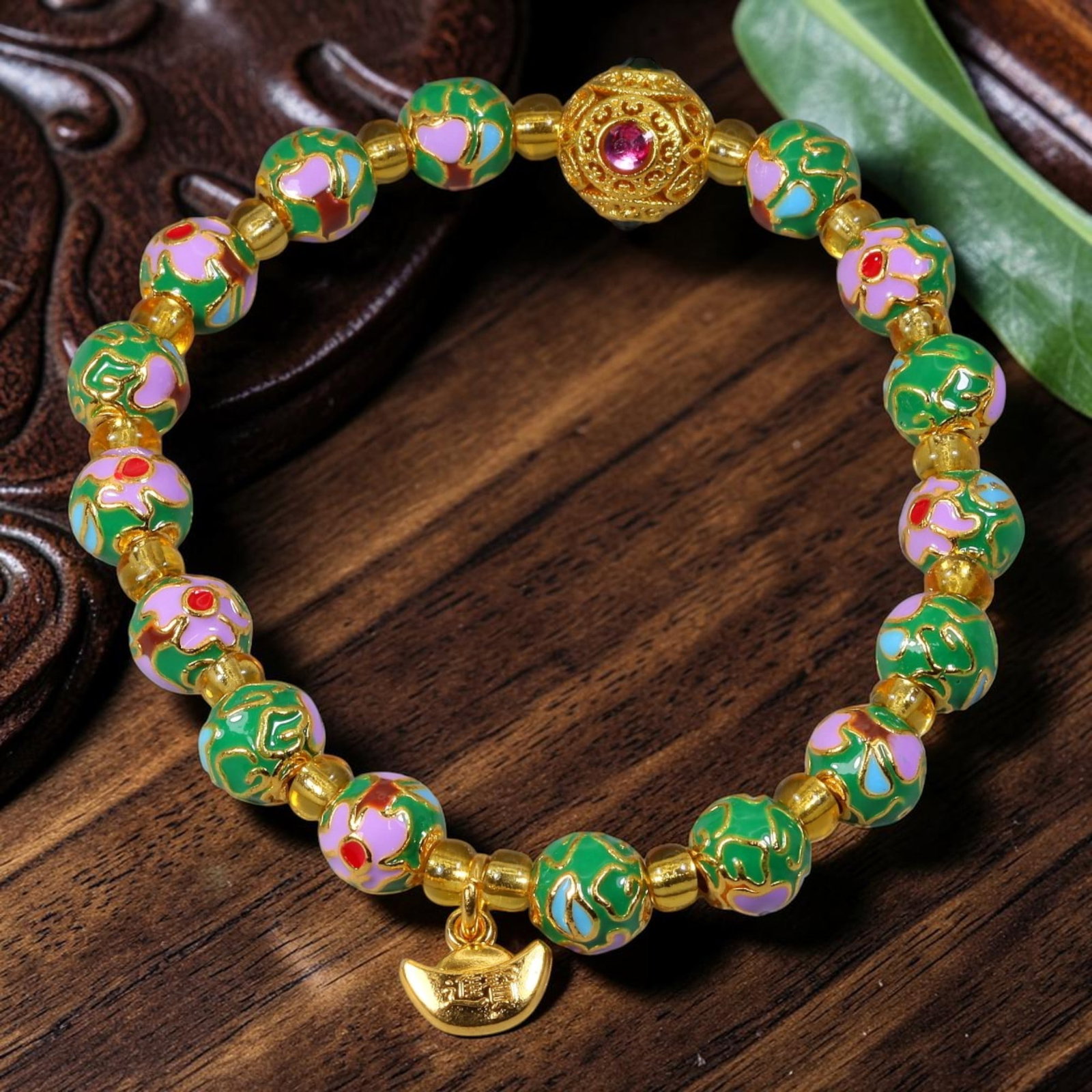 Chinese Cloisonne Enamel Beaded Bracelet - Emerald Green Gold Wealth Ingot Charm, 70YG: This modern Chinese revival stretch bracelet features round cloisonne enamel beads measuring 7.50 millimeters, finished in rich emerald green enamel with two alternating decorative styles: raised gold