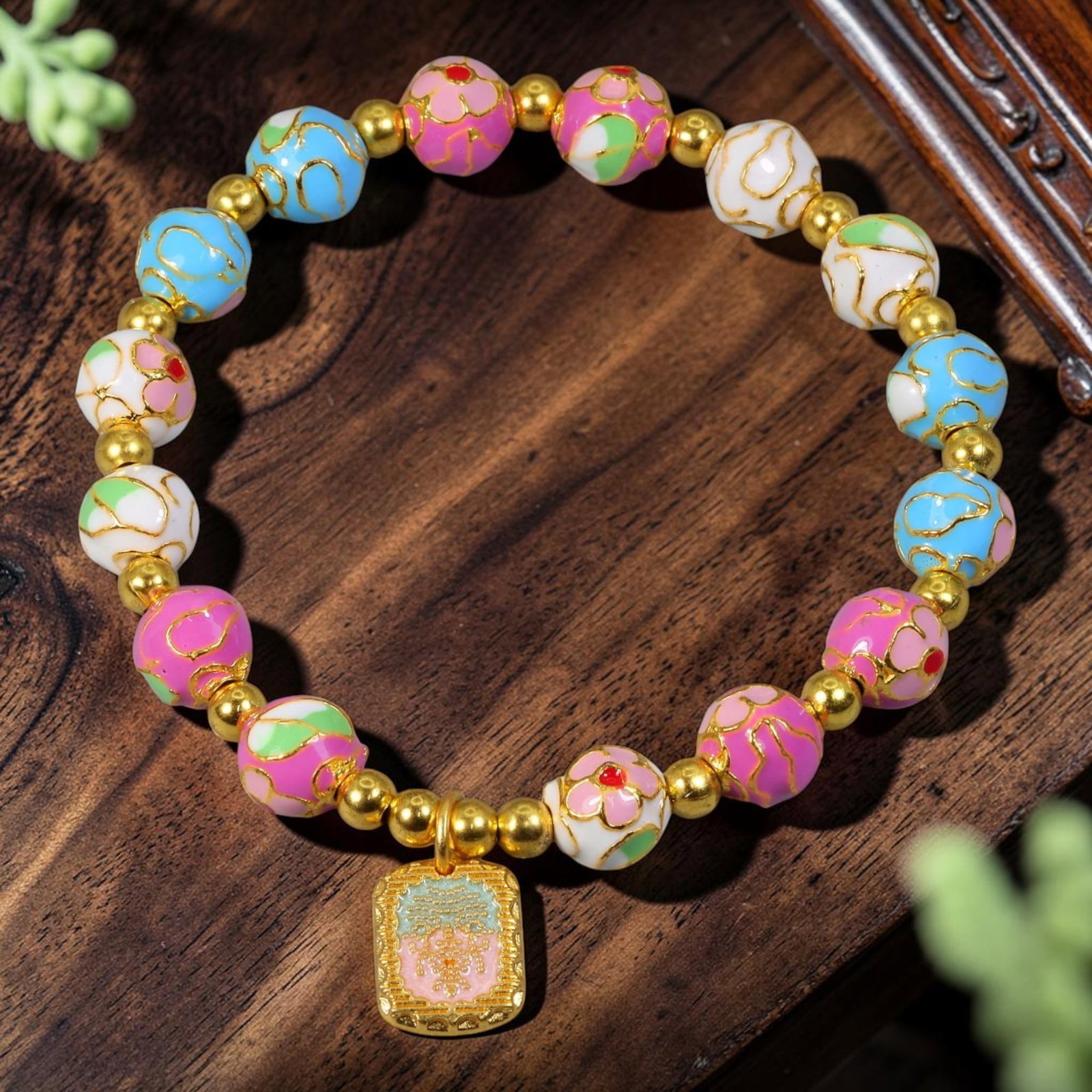 Chinese Cloisonne Enamel Beaded Bracelet - Pastel Rainbow Double Happiness Tag Charm, 64YG: This modern Chinese revival stretch bracelet features round cloisonne enamel beads measuring 8.00 millimeters, alternating soft sky blue, creamy white and blush pink enamel bases adorned with raised g