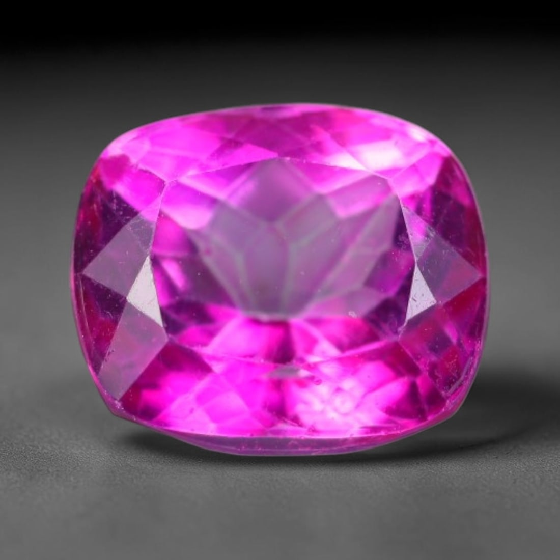 6.05 Carats Natural Vivid Pink Topaz Cushion Faceted Loose Gemstone, 15WS: This luminous cushion faceted pink topaz features vivid saturated hot pink hue shining through neatly polished facets, with faint minor natural internal fine textures visible within the clear crystal 