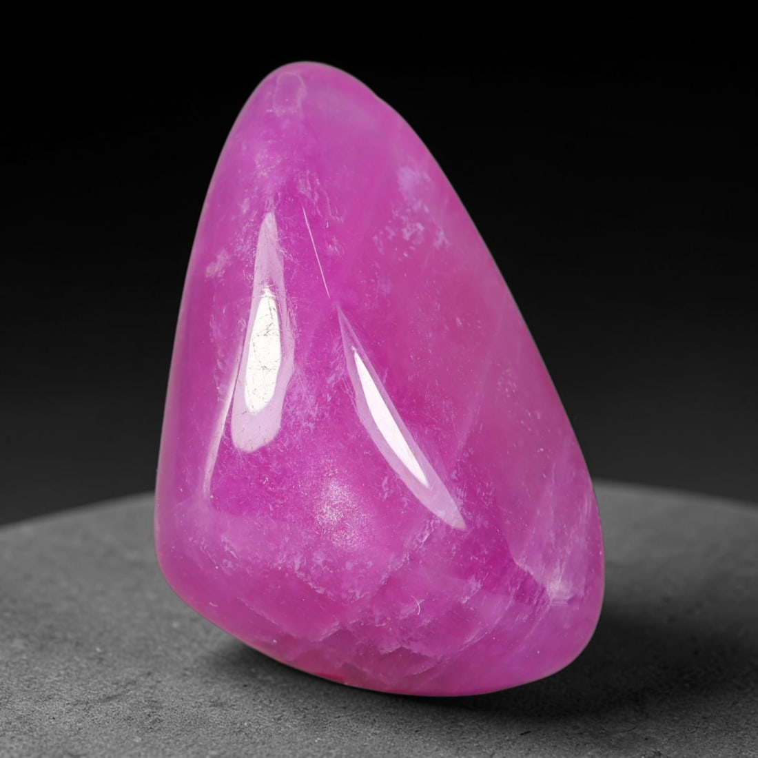28.38 Carats Natural Madagascar Vivid Fuchsia Pink Heated Ruby Pear Teardrop Cabochon, 85WC: This rich fuchsia pink ruby cabochon boasts deeply saturated magenta-pink color spread uniformly across its smooth polished domed surface, with natural faint crystalline veining and subtle internal mi
