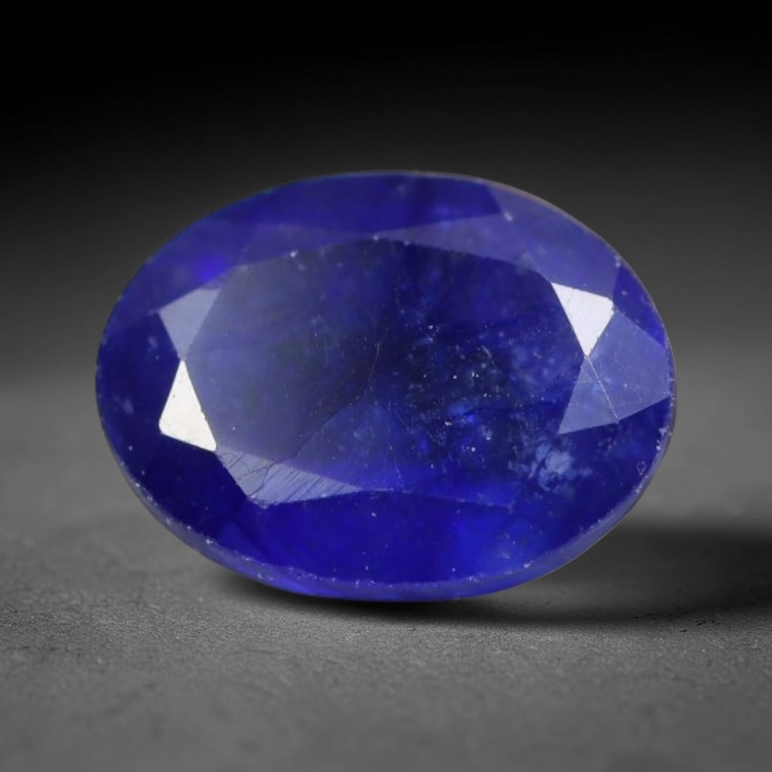 1.72 Carats Royal Blue Sapphire Oval Faceted Loose Gemstone, 41WS: This classic oval faceted sapphire displays rich saturated royal blue color glowing through crisp polished multi-facet cuts, featuring natural fine internal fissures and tiny scattered mineral micro s