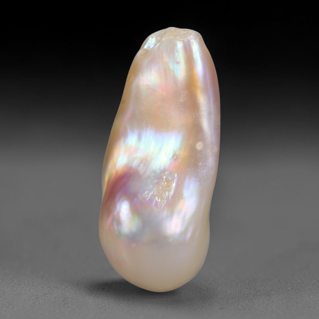 Natural Freshwater Keshi Pearl Baroque Loose Pearl, 98WE: This natural freshwater keshi pearl presents an organic irregular baroque silhouette with rich shifting iridescent nacre displaying soft champagne, peach and lavender overtones across its surface. Sub