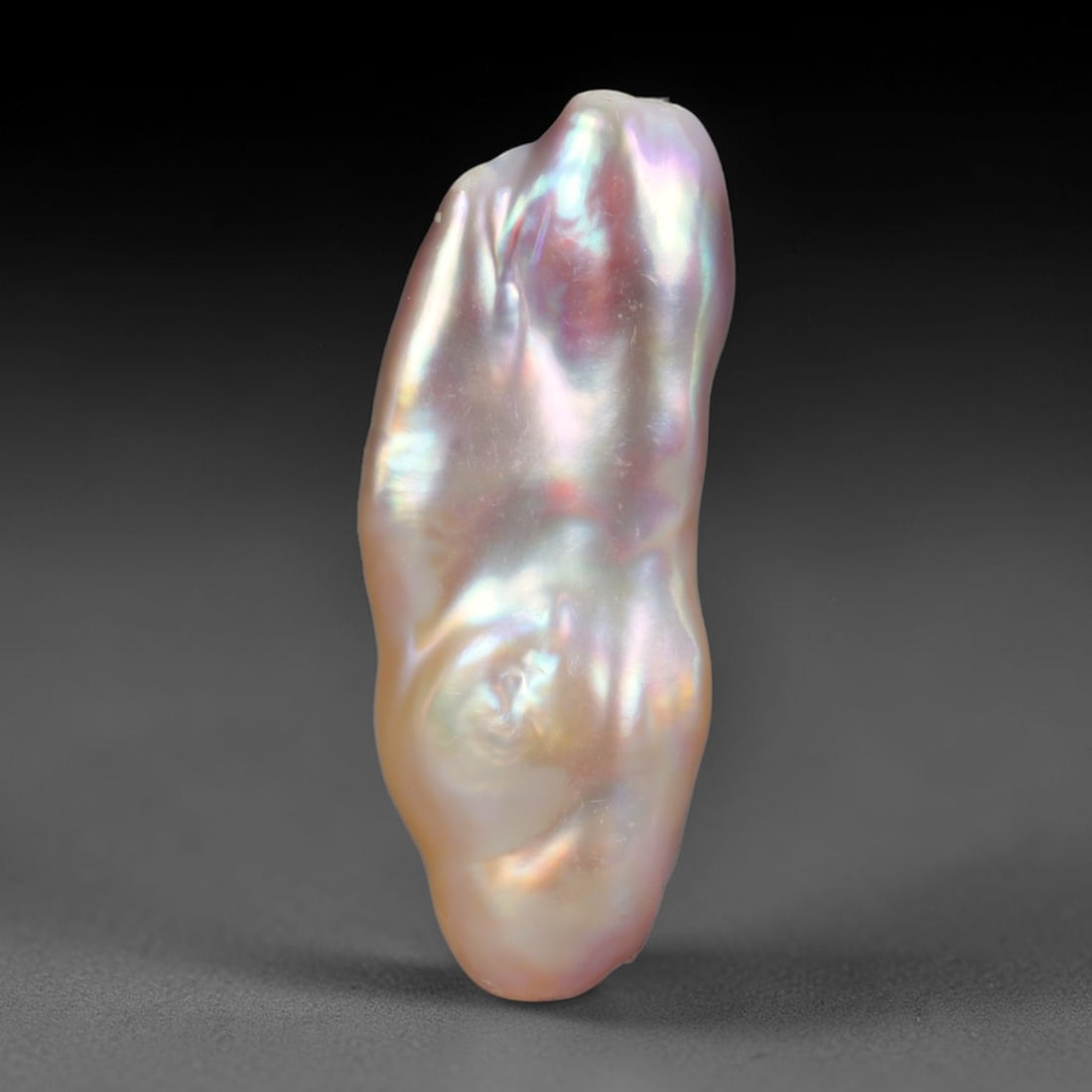 Natural Freshwater Keshi Pearl Baroque Loose Pearl, 96WE: This natural freshwater keshi pearl presents an organic irregular baroque silhouette with rich shifting iridescent nacre displaying soft champagne, peach and lavender overtones across its surface. Sub