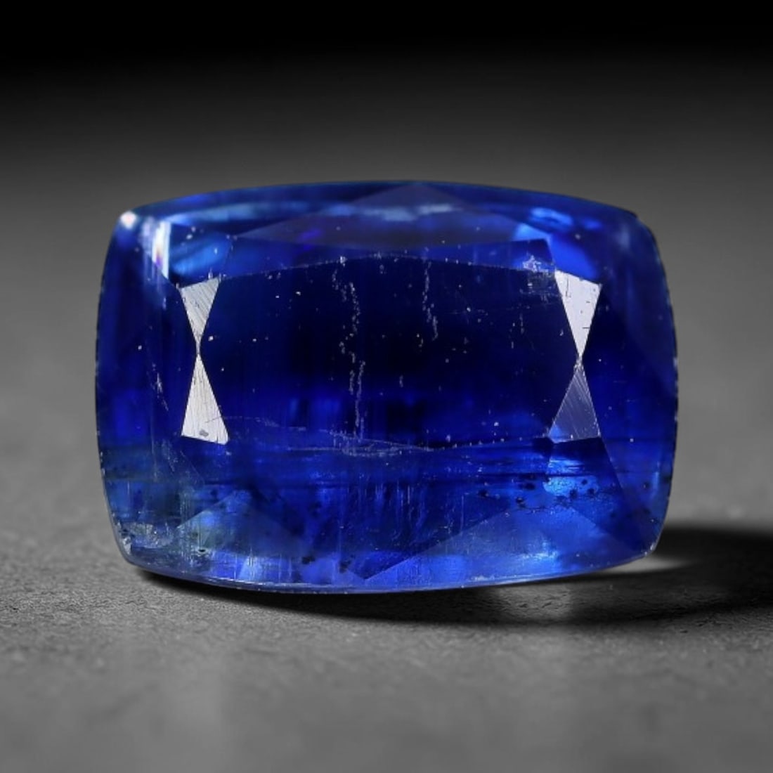 1.58 Carats Natural Vivid Royal Blue Rectangular Kyanite Step Cut Loose Gemstone, 28XV: Natural intense saturated royal blue kyanite expertly rectangular emerald step cut loose gemstone, linear parallel facets amplify deep rich blue saturation, showcasing striking vertical silvery fibrou