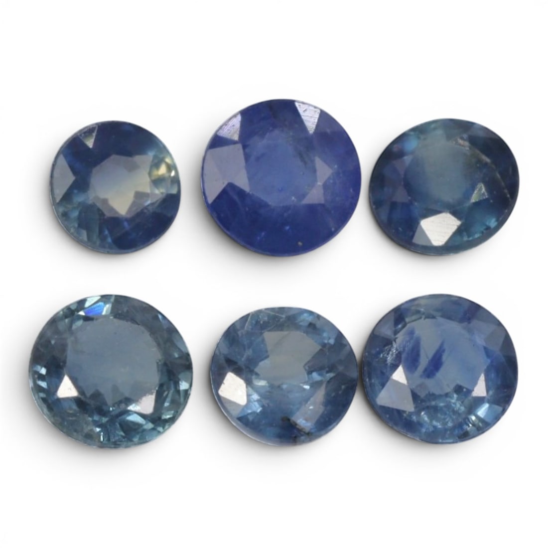 2.38 Carats Natural Blue Sapphire Round Faceted Parcel Loose Gemstone, 18YE: This parcel consists of multiple natural sapphire specimens, each processed with uniform faceting to support light refraction within their crystalline interiors. The stones display a spectrum of soft 