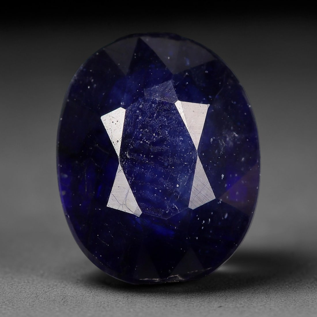 2.25ct Natural Deep Intense Royal Blue Oval Sapphire Loose Faceted Gemstone, LZ305: This natural oval faceted sapphire weighs 2.25 carats with precise dimensions of 8.7x6.9x3.6mm. It boasts a rich, saturated deep royal navy blue throughout the crystal, with subtle semi-translucent gr