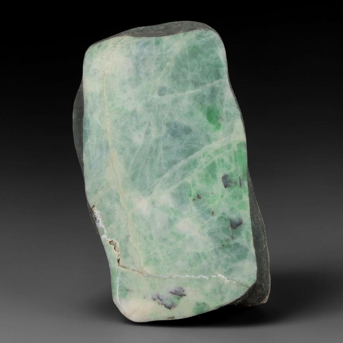 200ct Natural Type A Burmese Jadeite Jade Sliced Rough, 3YN: This specimen is a sliced rough block of natural Type A Burmese jadeite jade. The interior displays natural colour zoning with visible mineral veining and crystalline patterns typical of unprocessed j