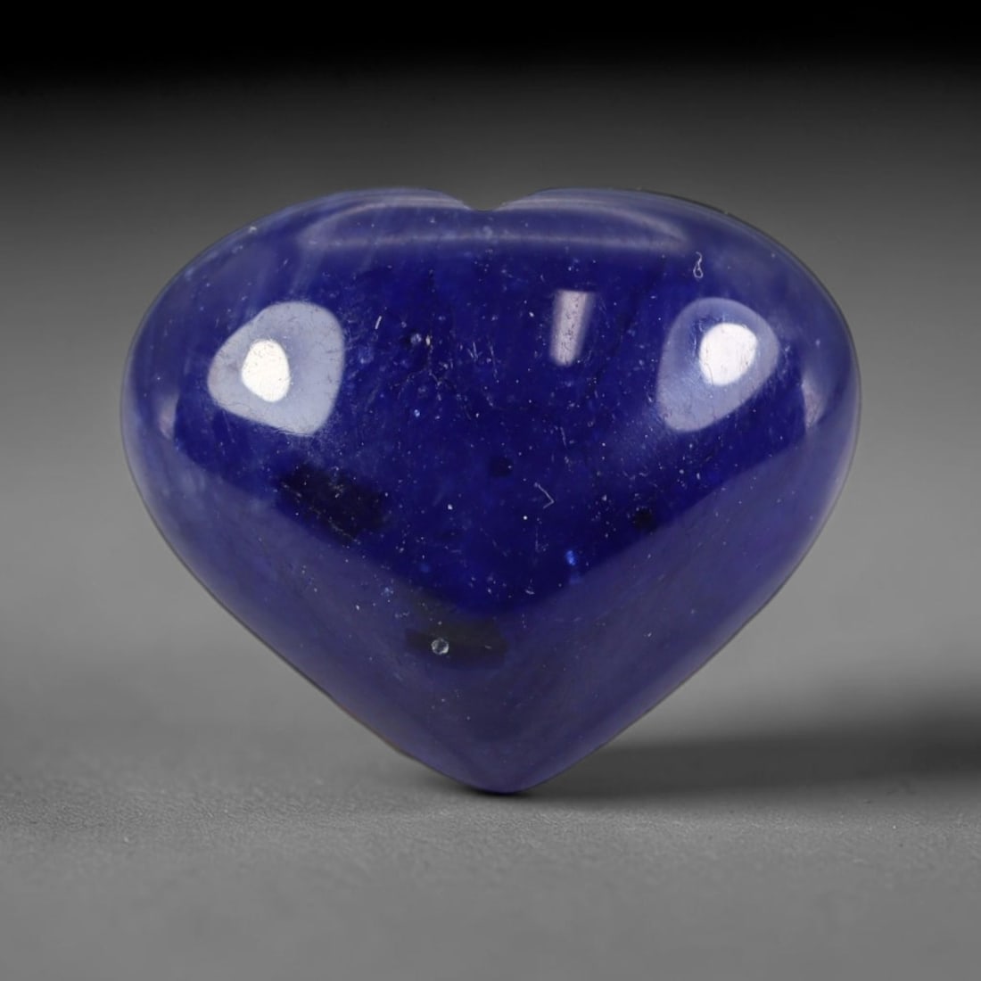 11.23 Carats Natural Madagascar Deep Royal Blue Heated Sapphire Heart Cabochon Loose Gemstone, 32WS: This rich deep royal blue sapphire cabochon features dense saturated navy blue tones spread evenly over its smooth polished heart domed surface, dotted with fine natural silk inclusions, tiny mineral 